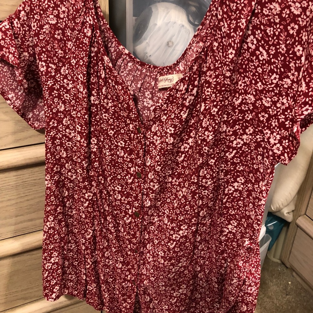 Red tee with white floral design